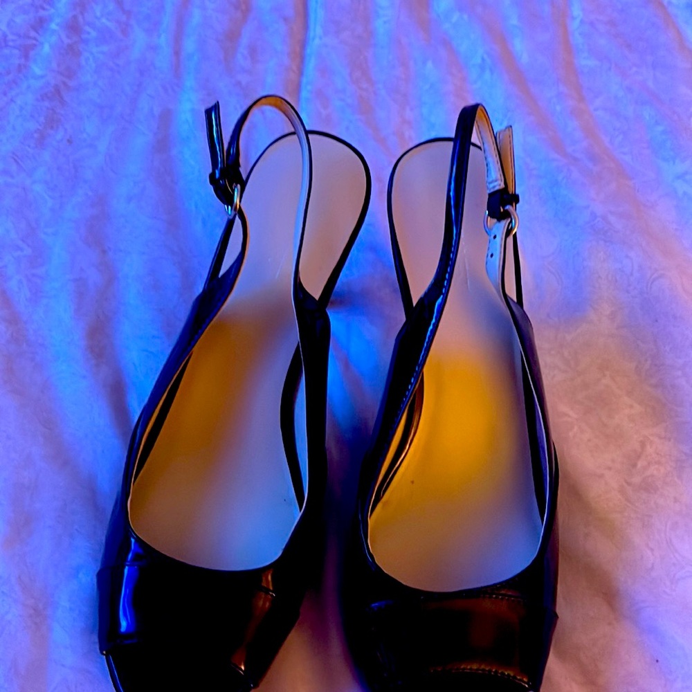 black sling  back shoe is in good condition . It size 11 . Price $60 . Price $40